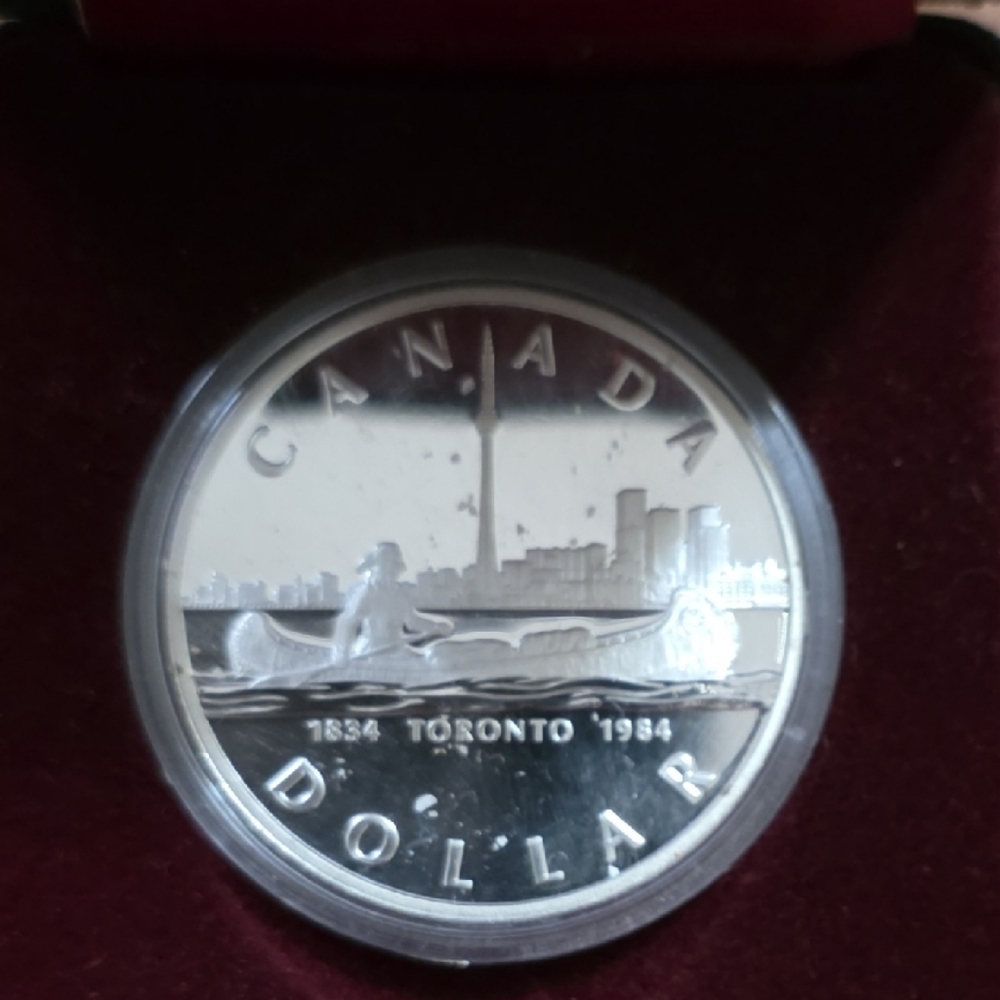 Vintage Canadian Dollar Coin in Display Case